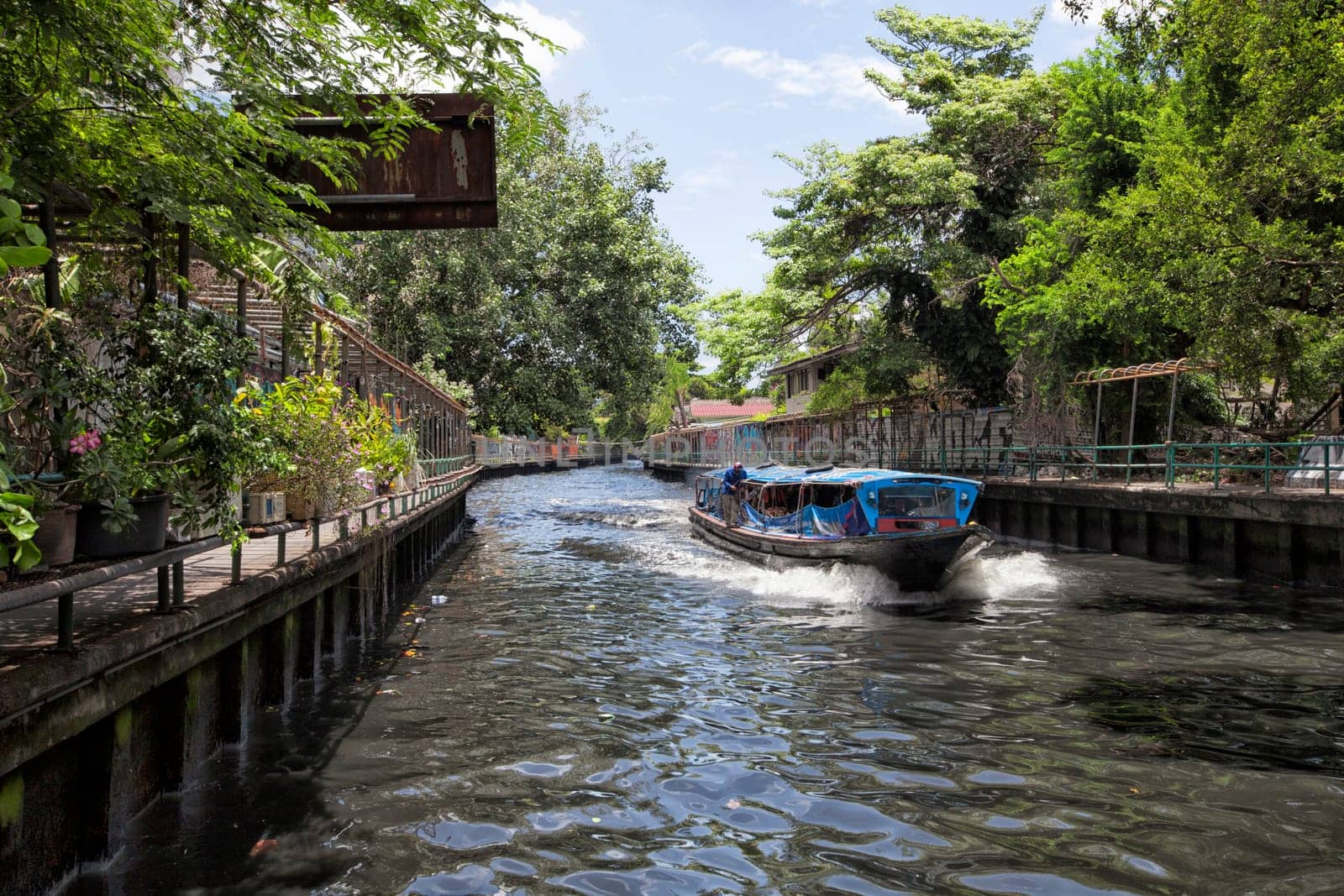 River boat transporting passengers and tourist down Chao Praya river , Bangkok , Thailand