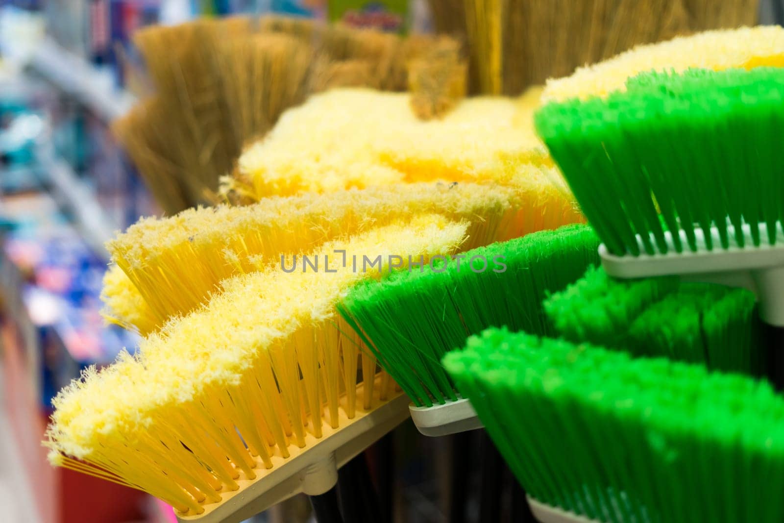 Large assortment of brushes for cleaning premises in store. Trade in floor cleaning equipment