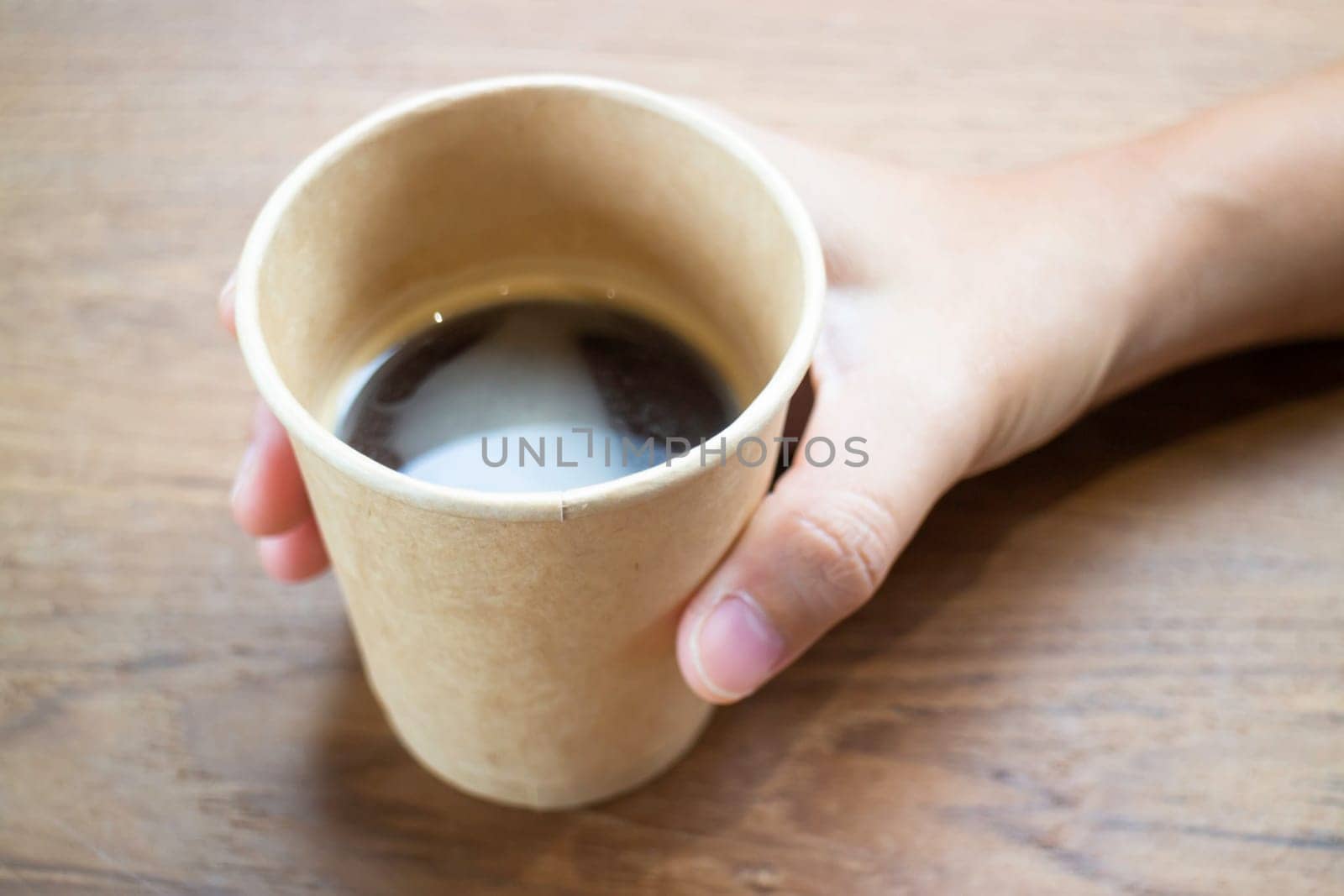 Disposable cup of hot black coffee, stock photo