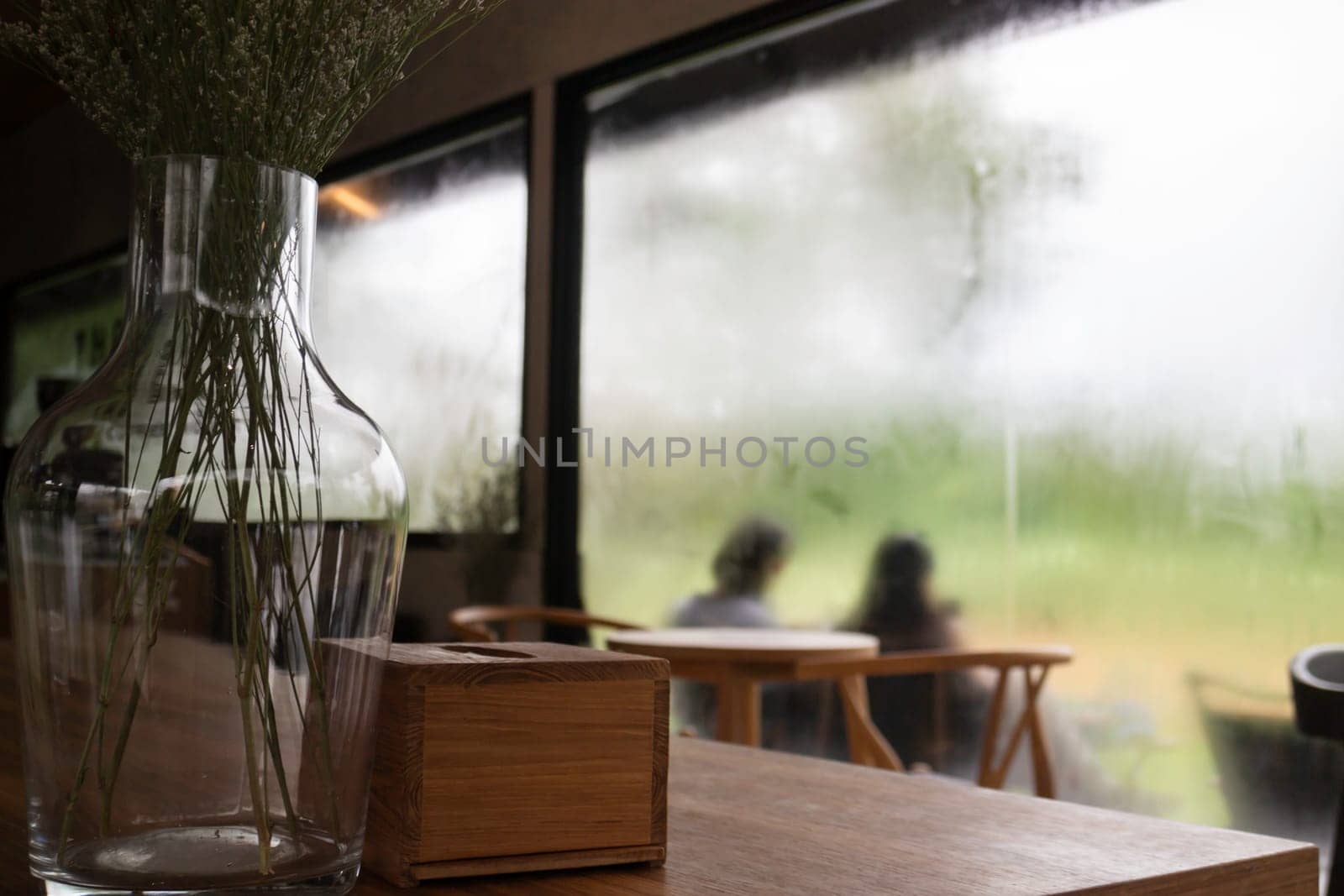 Looking at the rain through the window, stock photo