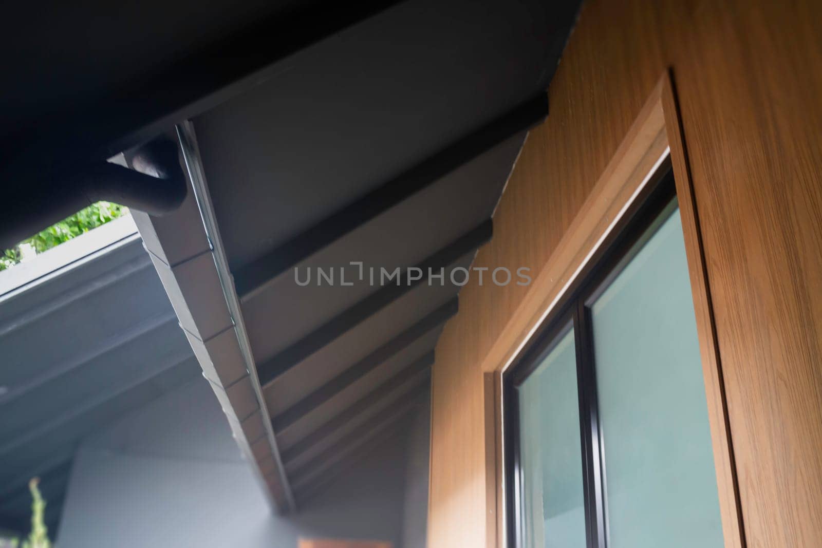House exterior style with black roof tiles, stock photo