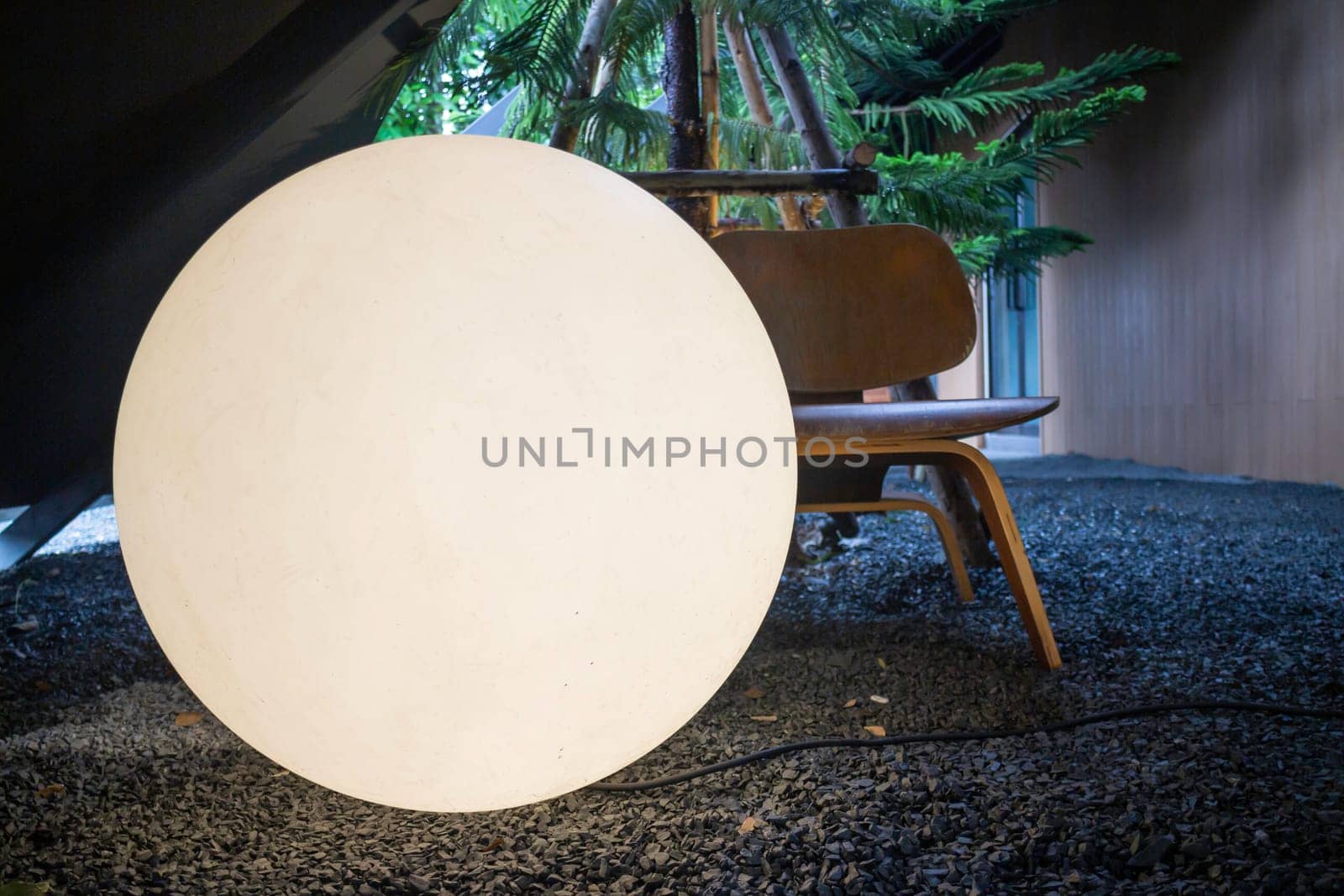 A bright glowing matte white burning round light bulb, stock photo