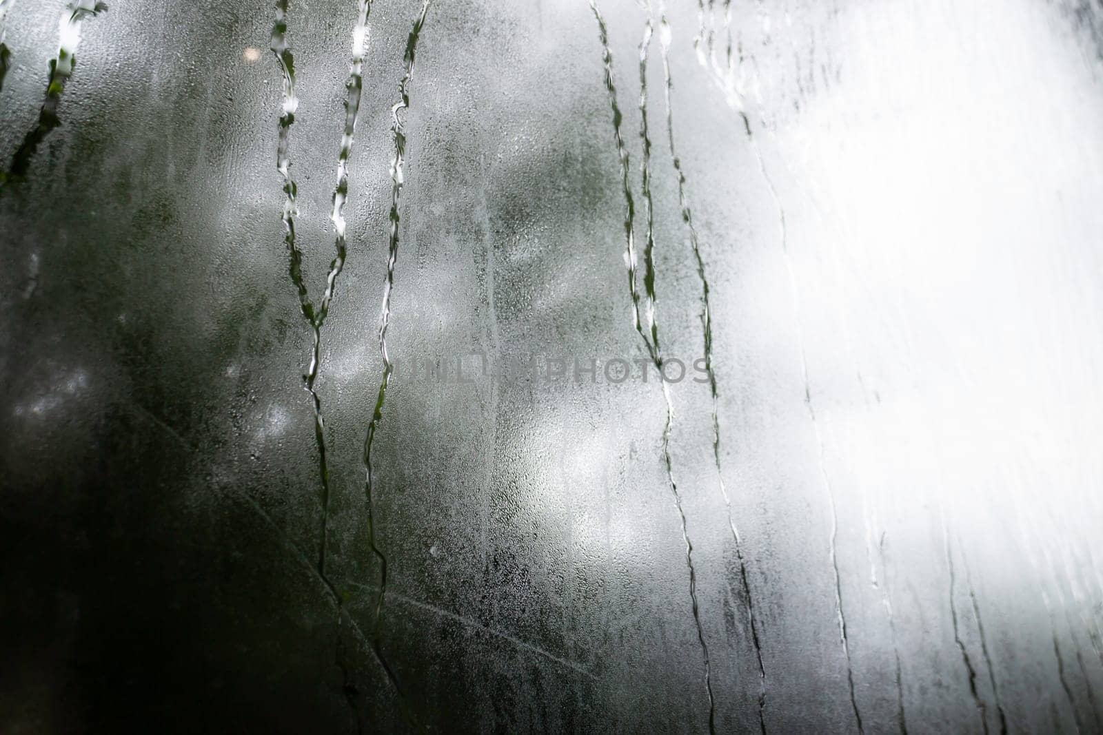 Looking at the rain through the window, stock photo