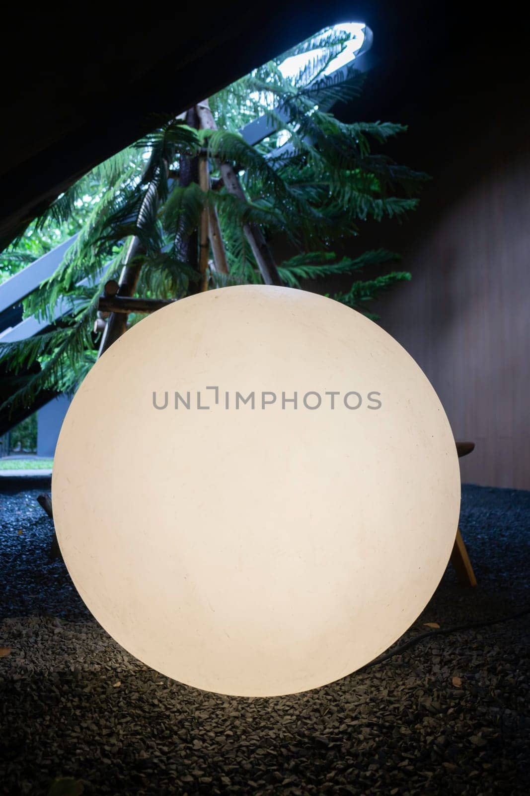 A bright glowing matte white burning round light bulb, stock photo