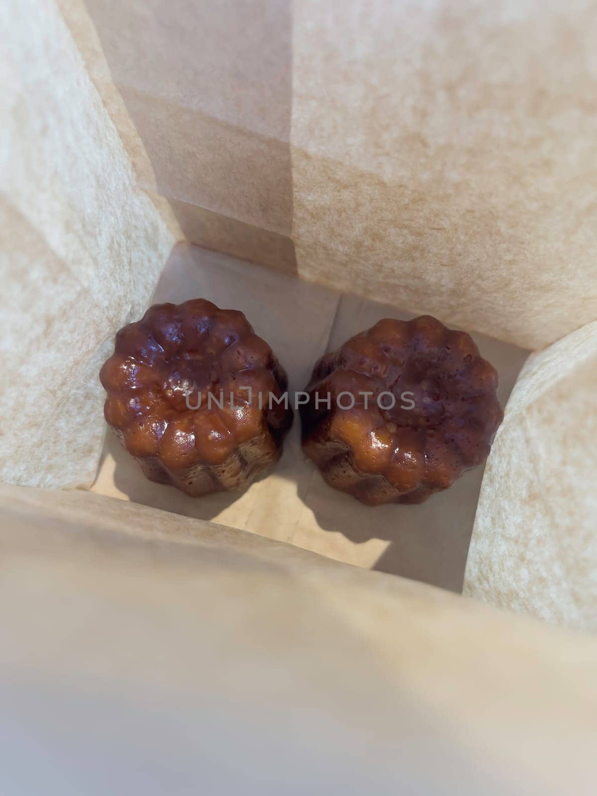 Fresh homemade caneles french pastry, stock photo