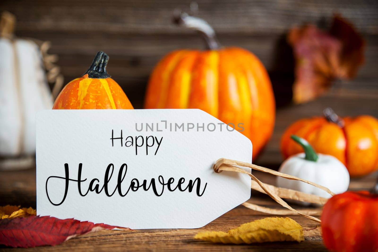 Autumn Decoration With Orange Pumpkins, Rustic fall Decoration With Label Text Happy Halloween
