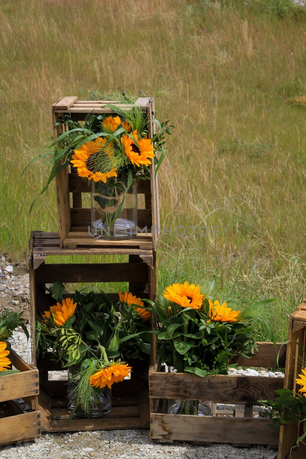 A festive decoration with beautiful yellow sunflowers.