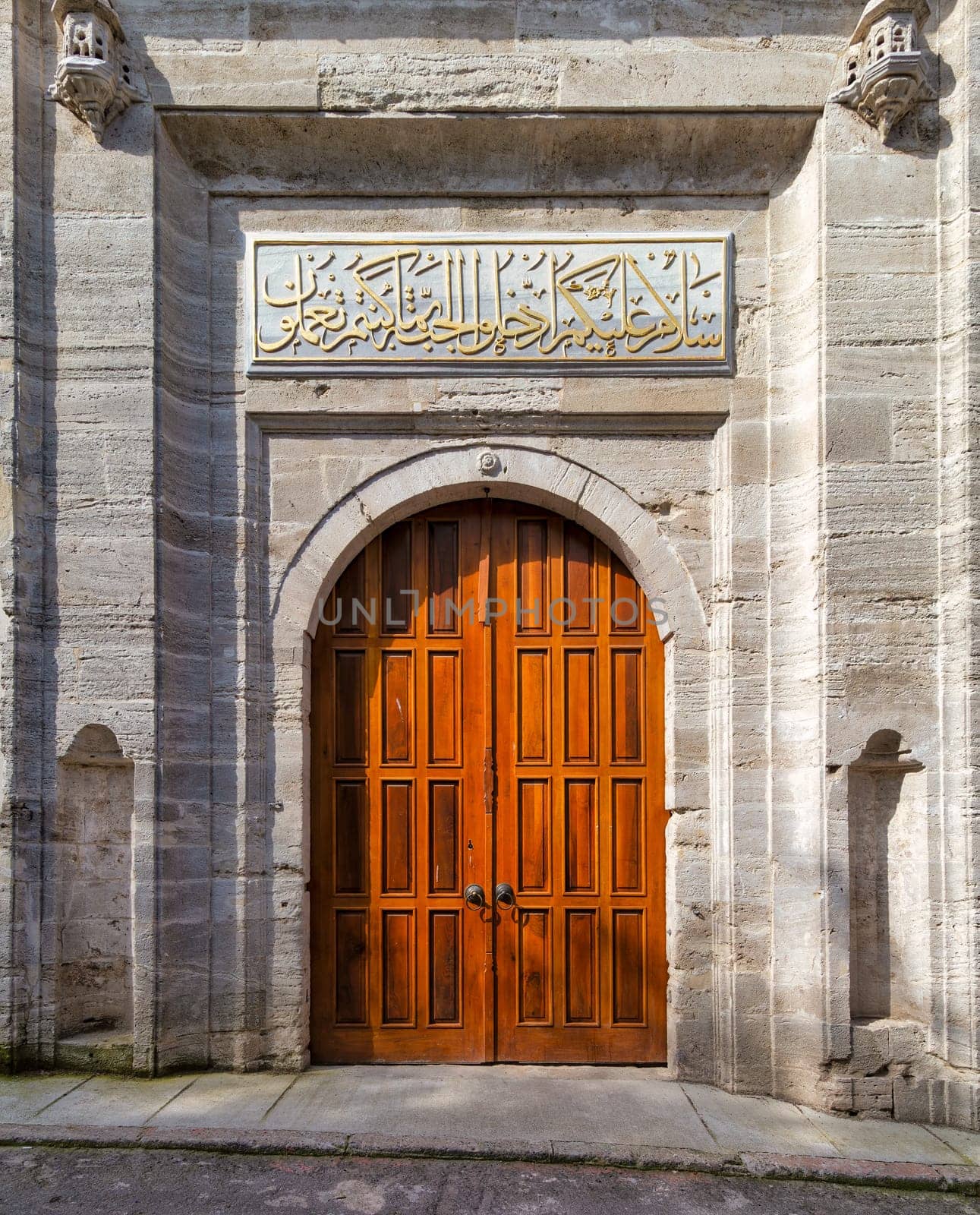 Side entrance of Ottoman Baroque style Ayazma Mosque, Uskudar district, Istanbul, Turkey. Text above translate: Peace be on you, enter you Paradise, because of which you used to do