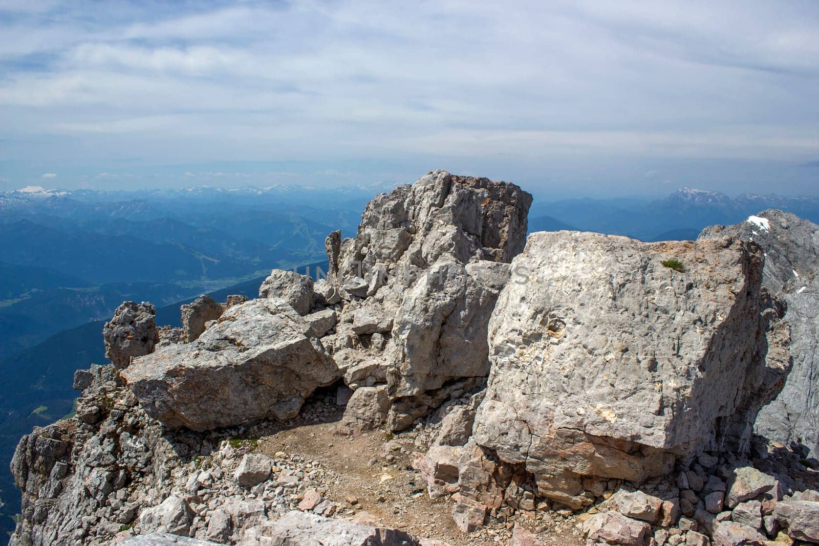 Panorama of massive Alpine mountains. Landscape in the Austrian Alps of the Dachstein region (Styria in Austria) - view from Dachstein