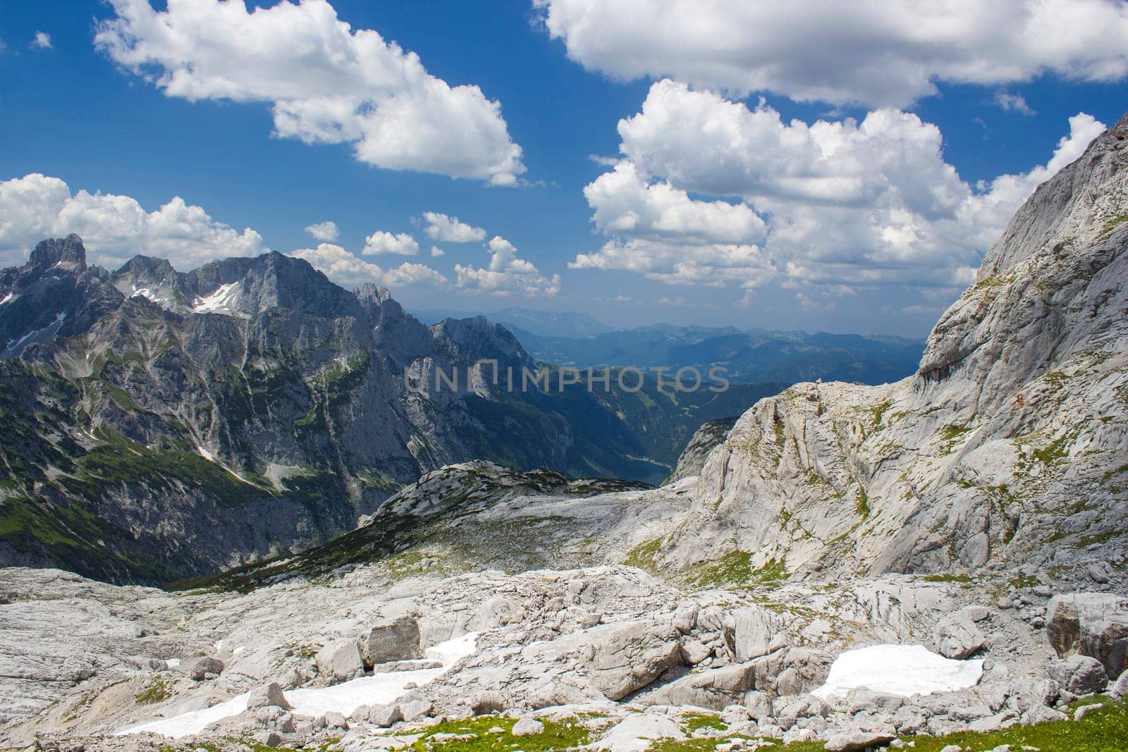 Panorama of massive Alpine mountains. Landscape in the Austrian Alps of the Dachstein region (Styria in Austria) - view from Dachstein