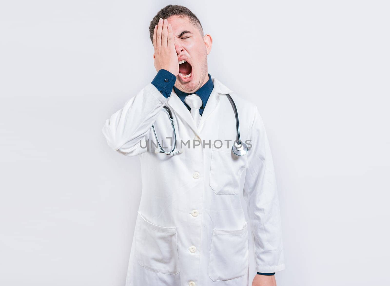 Sleepy doctor yawning on isolated background. Tired of working doctor concept, Tired and sleepy doctor isolated