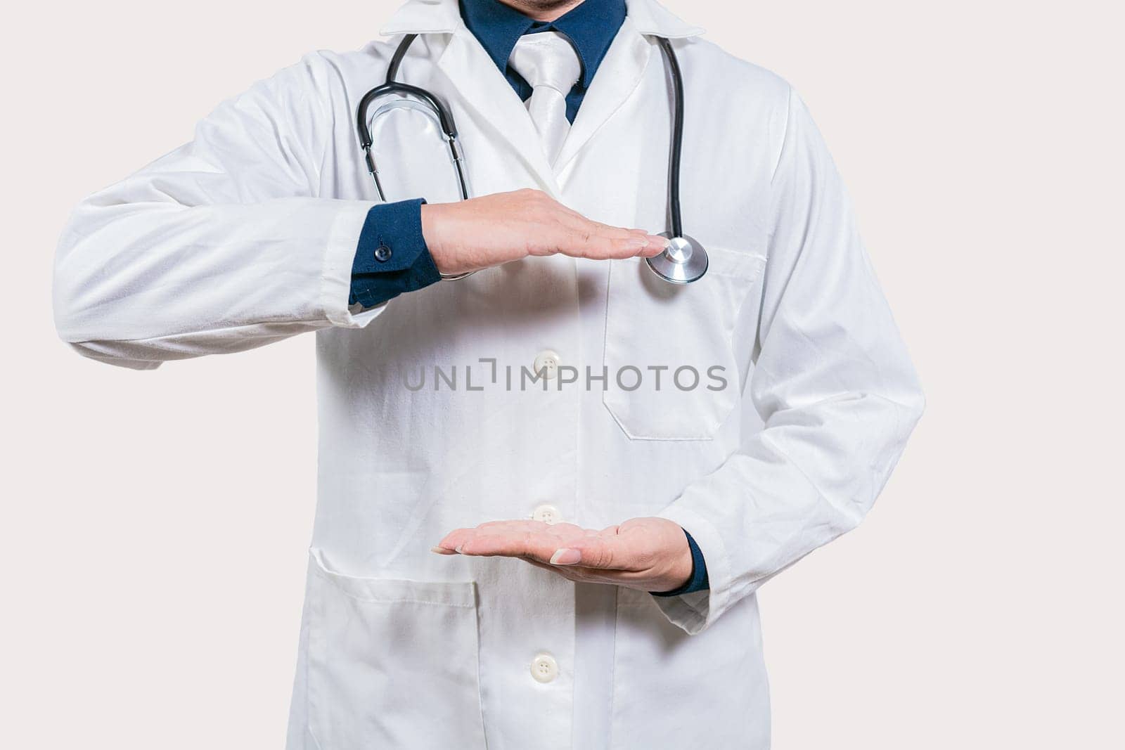 Doctor hands presenting something empty handed. Doctor holding something in his hands isolated, Unrecognizable doctor holding empty hands isolated