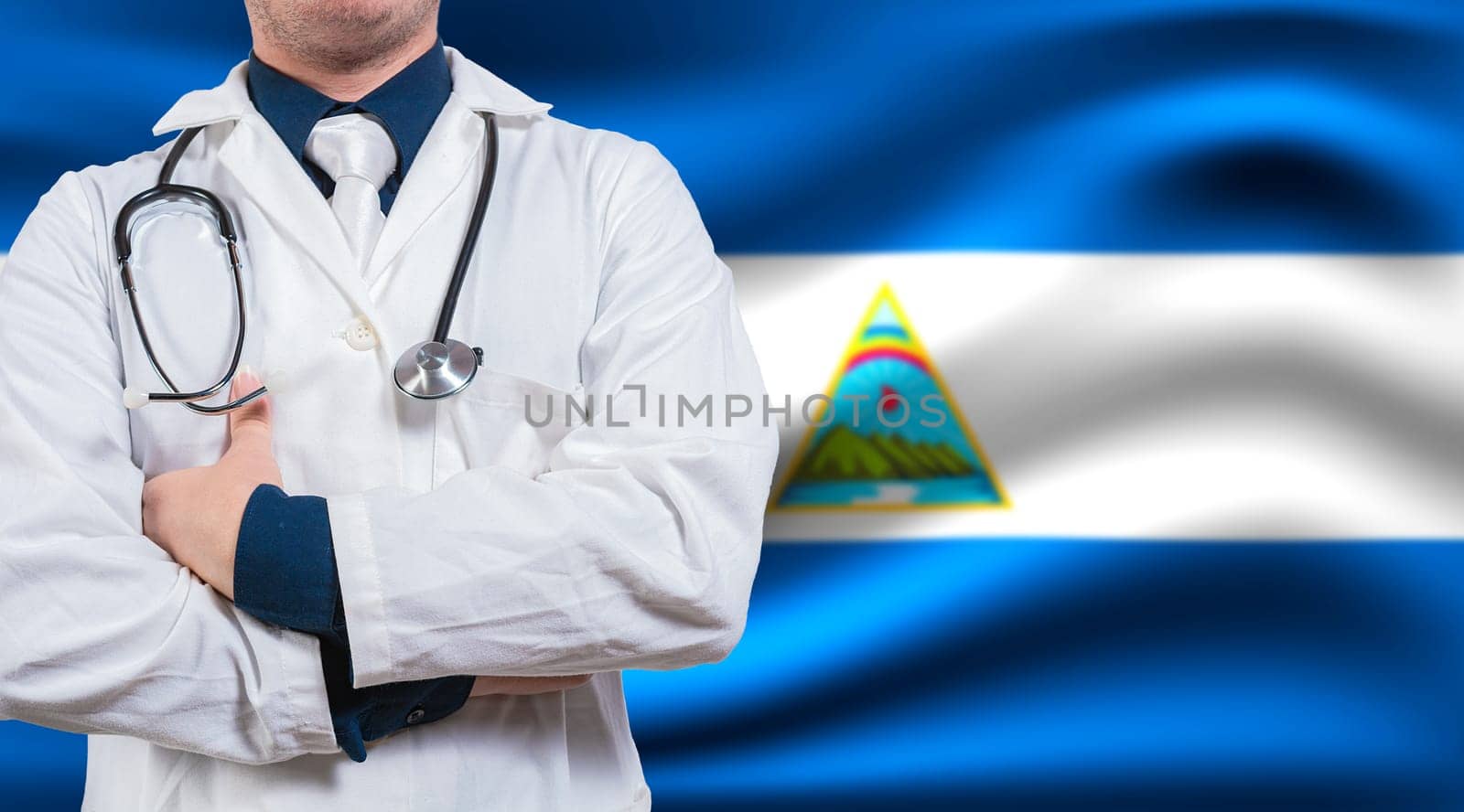 Doctor with stethoscope on flag of Nicaragua. Health and care concept with Nicaragua flag. Doctor with crossed arms on flag of Nicaragua