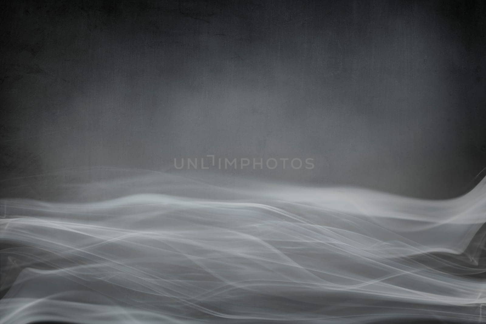 Spooky dark Halloween background banner design with copyspace. Abstract smoke on grunge textured backdrop.