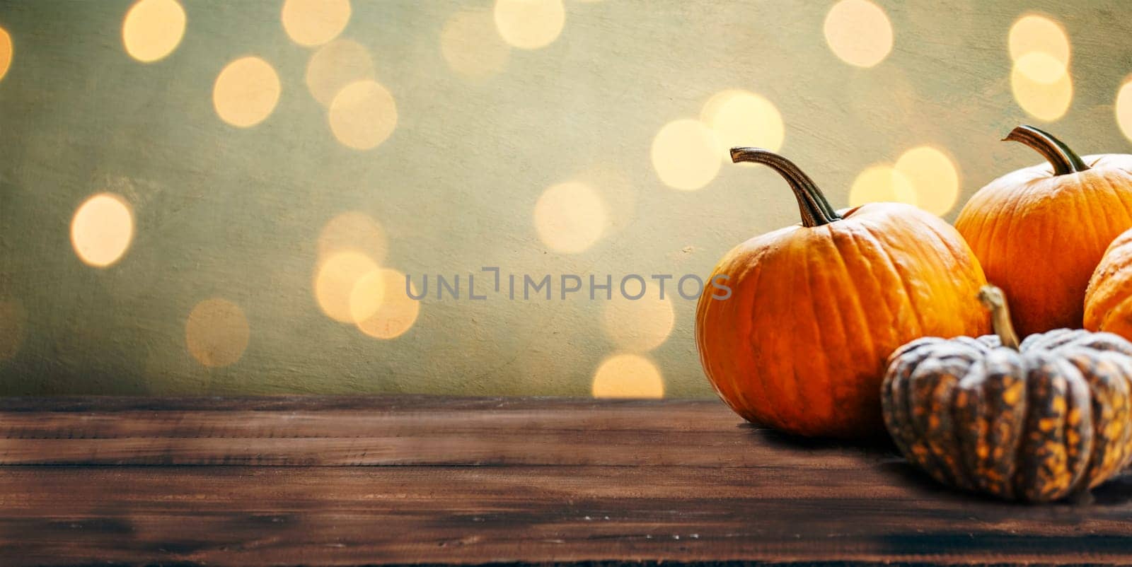 Autumn pumpkins still life on vintage wooden table and rustic background. Thanksgiving family dinner greeting card design. Halloween pumpkin decoration border. Holiday festival concept.