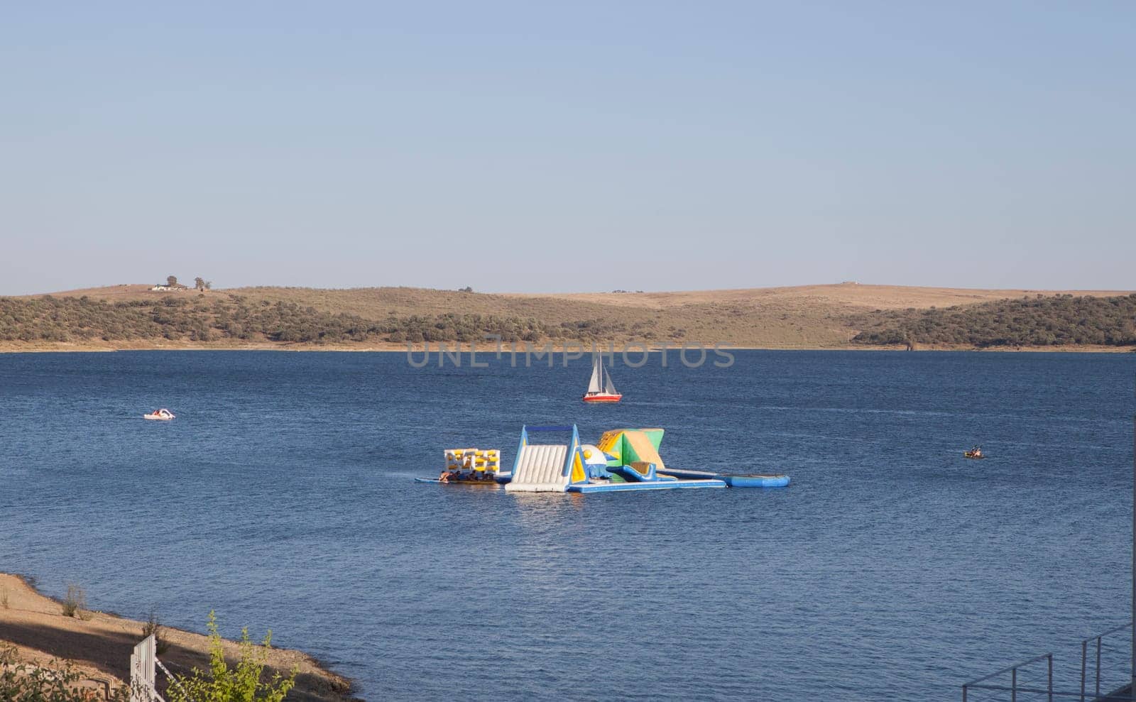 Costa Dulce de Orellana, unique inland beach in Spain awarded with the Blue Flag, Badajoz, Spain. inflatable water park