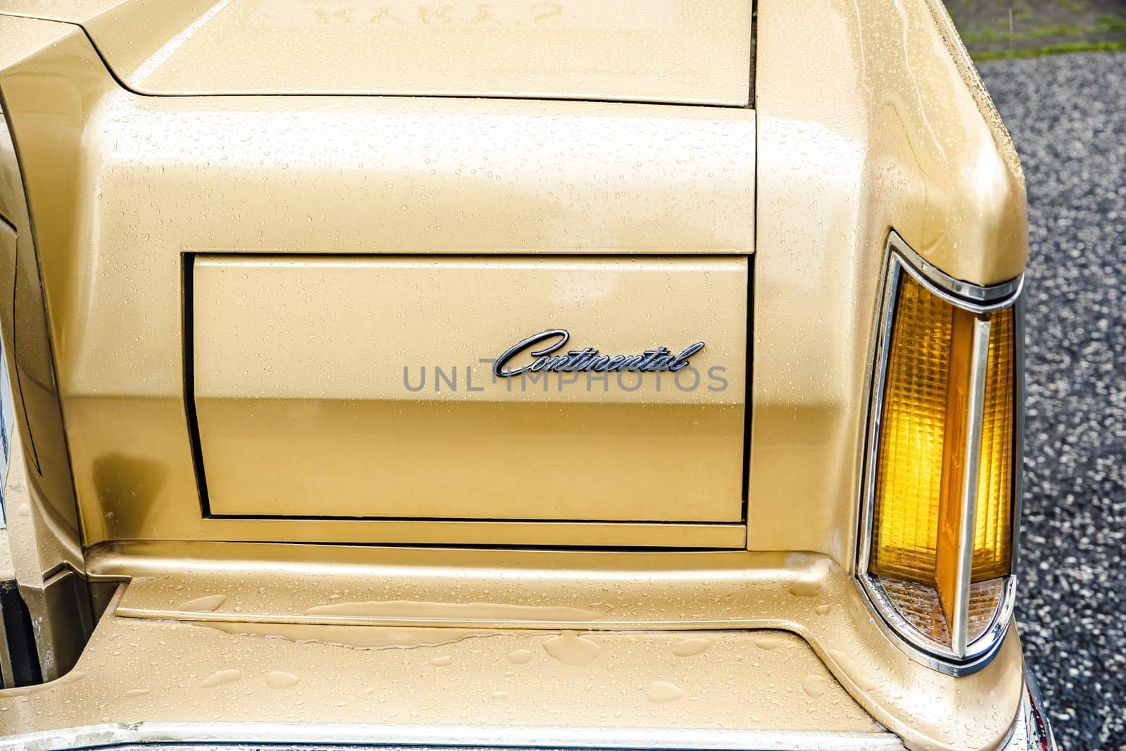WETTENBERG, HESSE, GERMANY - 07 - 28 - 2023: Detail from golden metallic LINCOLN CONTINENTAL on a traditional Car Show Golden Oldies.