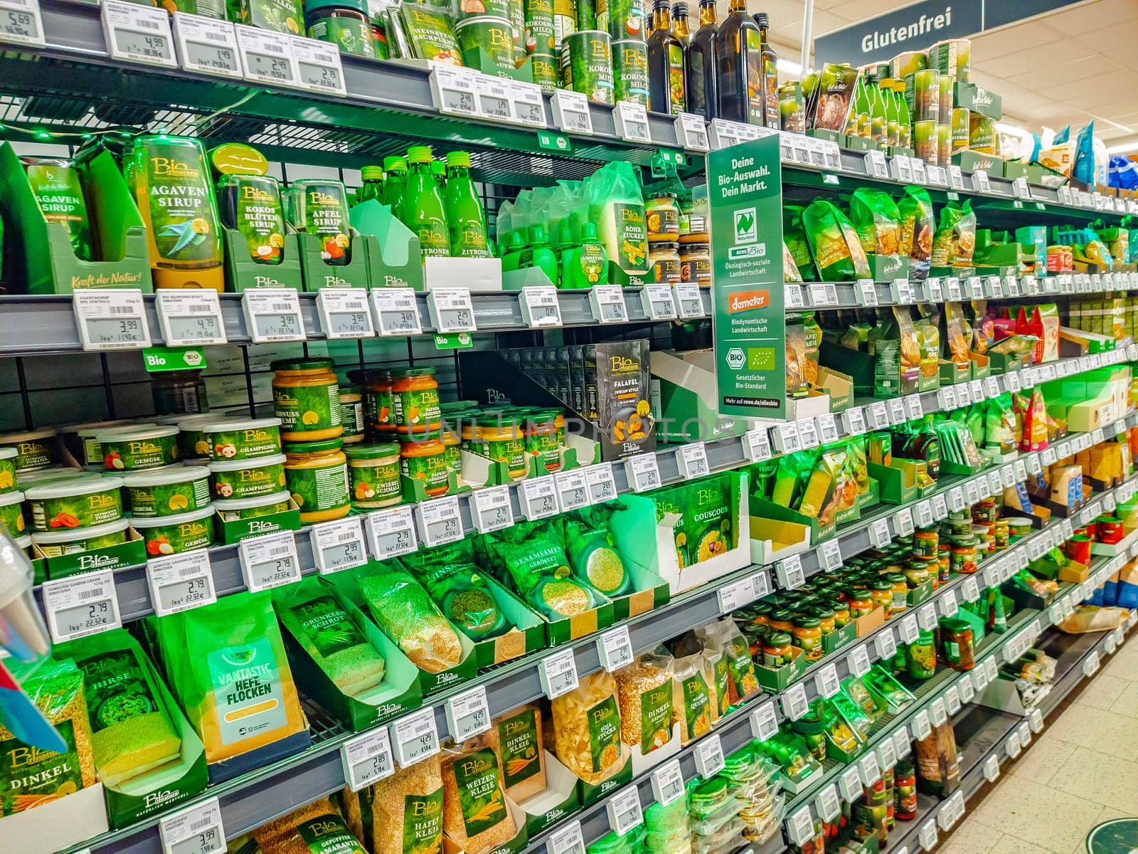 HUETTENBERG, HESSE, GERMANY_ 12_05_2022: Arrangement of organic and vegan food in a shelf of a grocery.