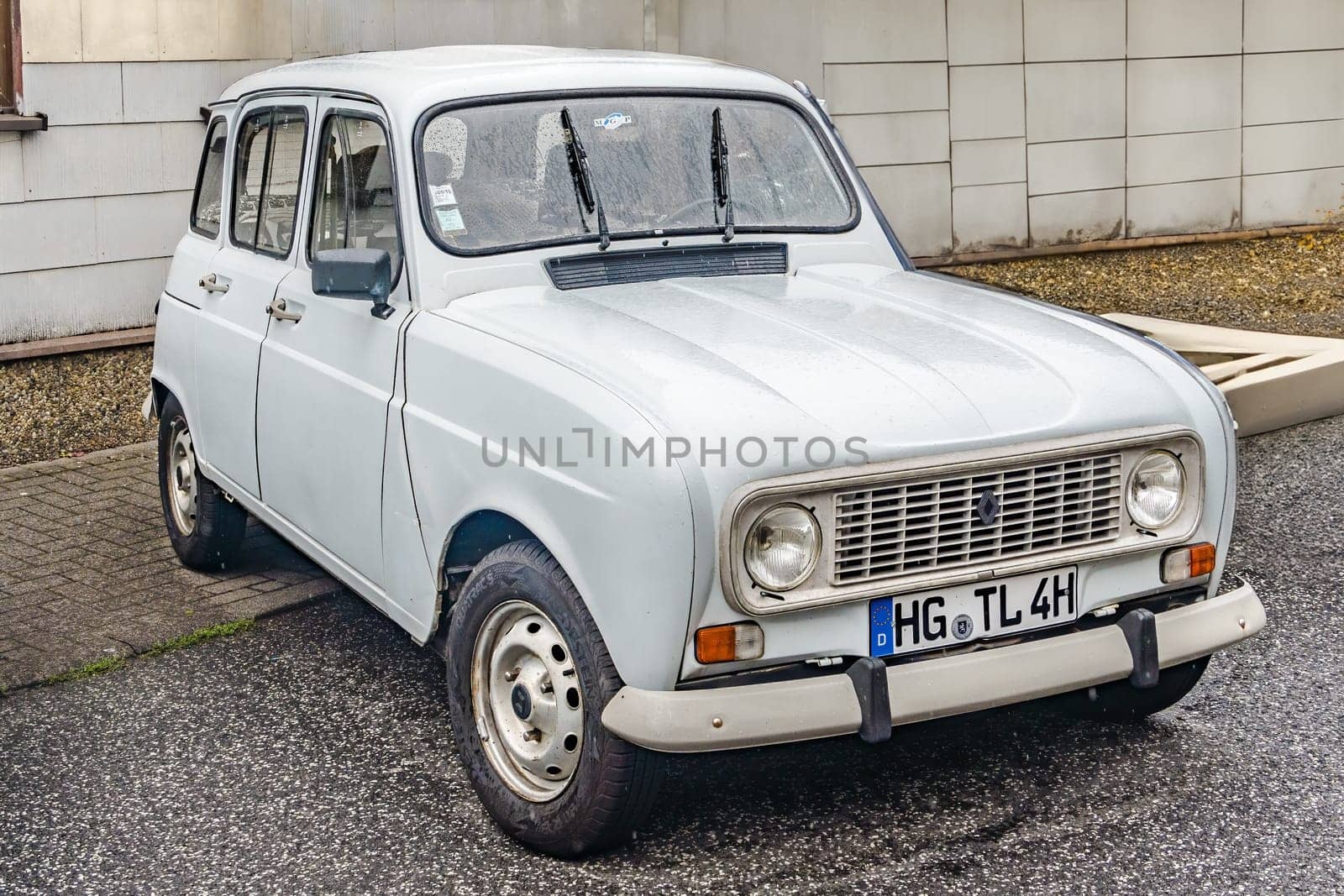 WETTENBERG, HESSE, GERMANY - 07 - 28 - 2023: RENAULT R 4 - French Renault 4 small car in white from the seventies and eighties on a traditional Car Show Golden Oldies in Krofdorf-Gleiberg near Giessen, Hesse.