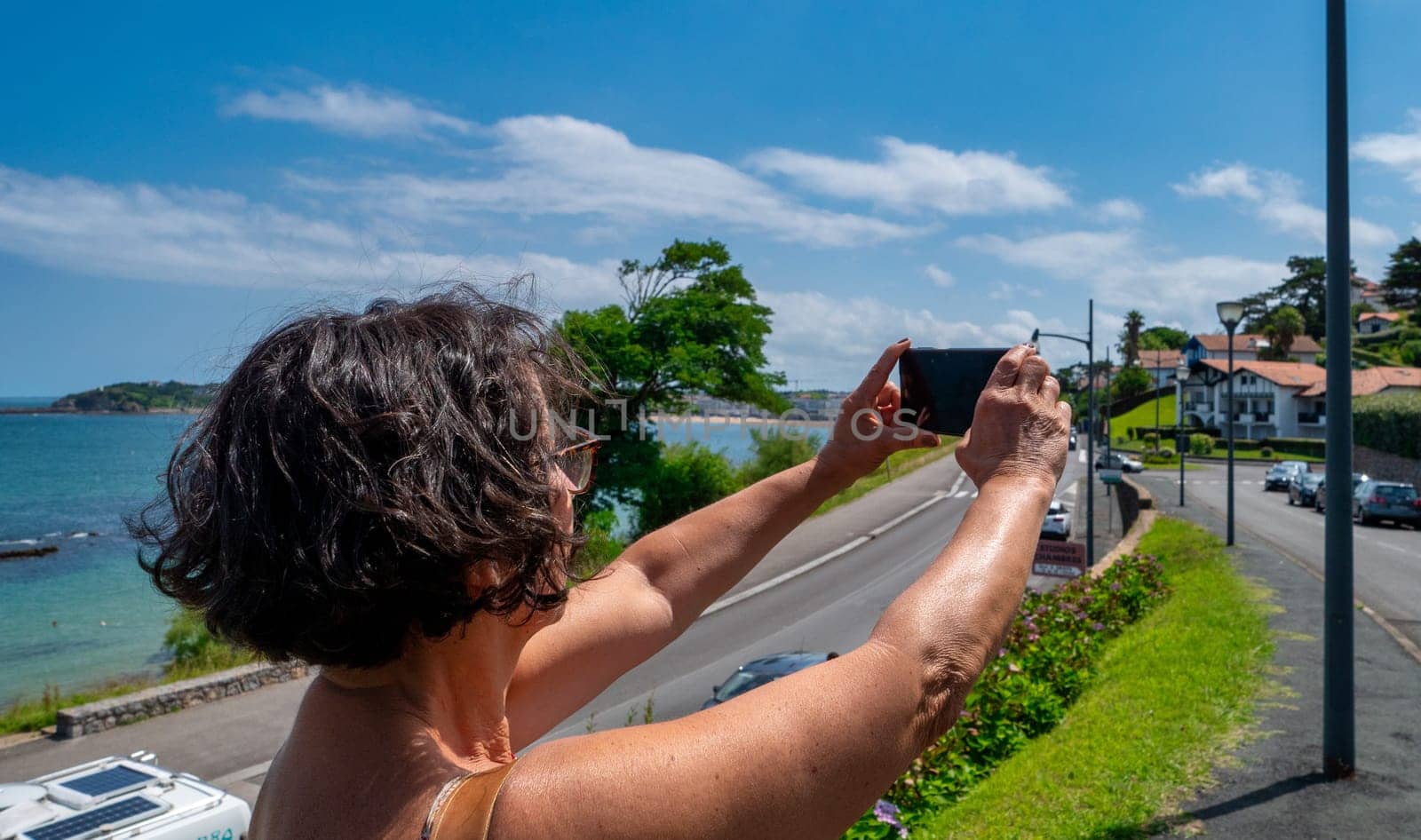 a woman take a picture with smartphone