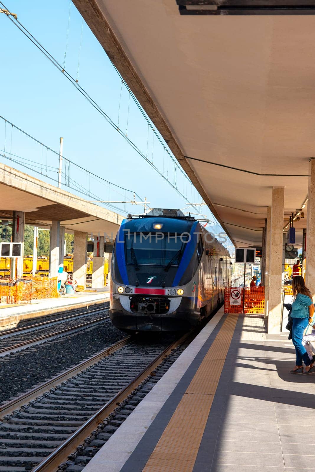 MILAZZO, SICILY, Italy - 03 October 2023. A Trenitalia train arriving at Milazzo station for onward journey to Palermo Central.