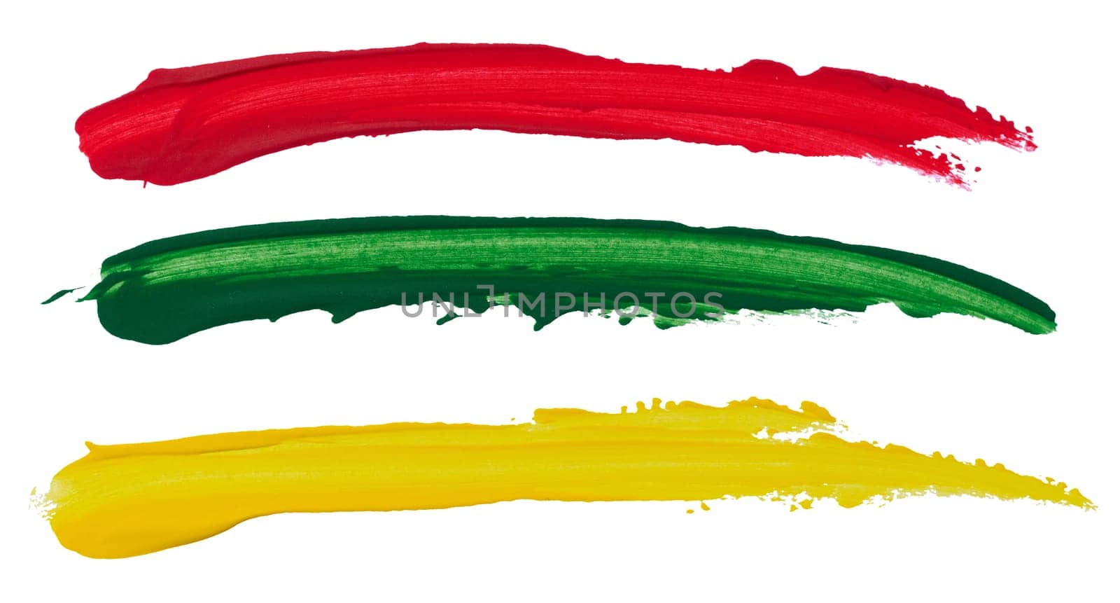 Strokes of red, green and yellow acrylic paint on a white isolated background