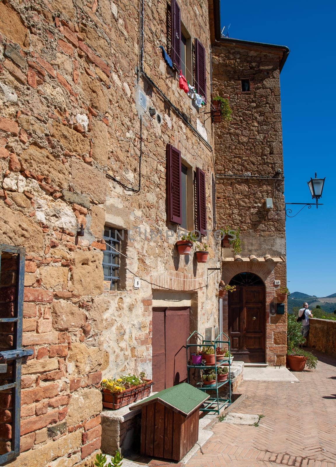 Pienza, Italy - Sept 12, 2022: Pienza, a tiny village in the Tuscany, known as the ideal city of the Renaissance and a capital of pecorino cheese. UNESCO World Heritage Site.