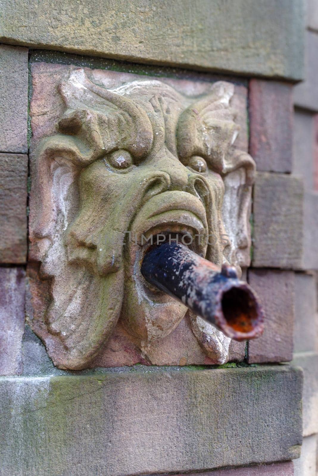 part of the historical fountain at stortorget square in stockholm, sweden.