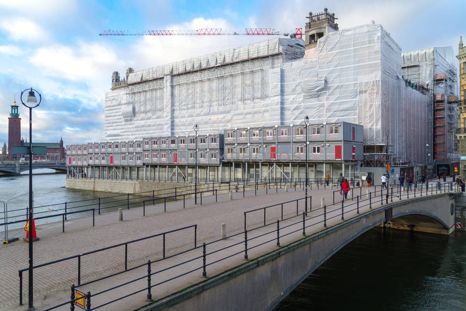 STOCKHOLM, SWEDEN- DECEMBER 23, 2020: Large building under construction with the State bridge (Riksbron) in front.