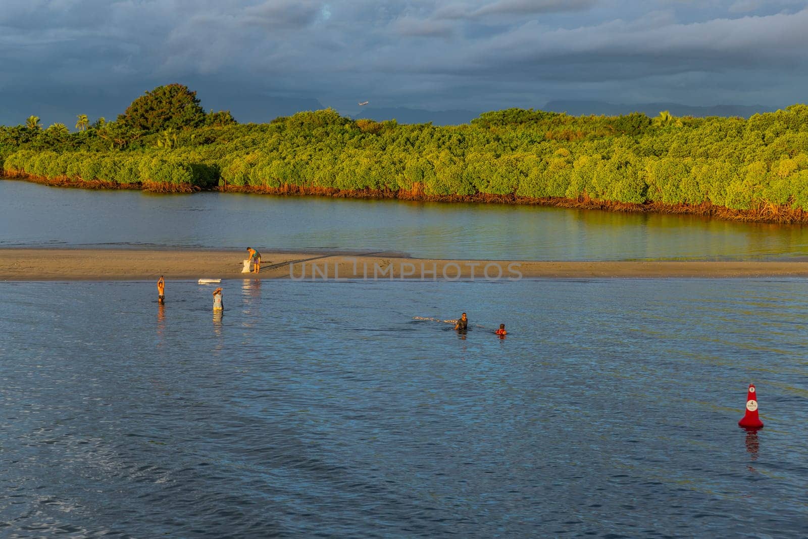 Viti Levu, Fiji: 29 May 2023: People fishing in the mangroves, Port Denarau, near Nadi, Viti Levu, Fiji Islands, South Pacific