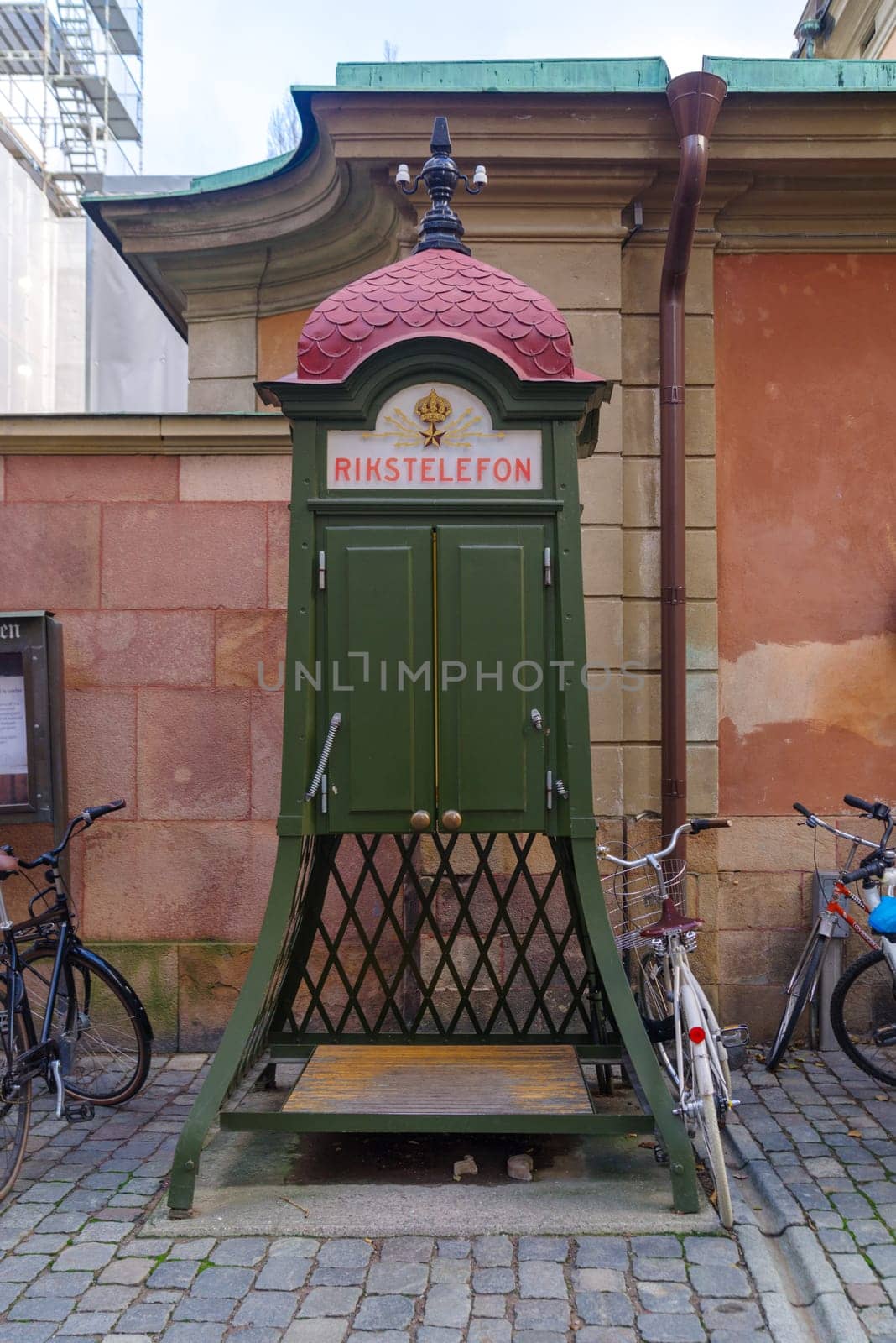 old public telephone booth (rikstelefon) in the old city center (gamla stan) of stockholm