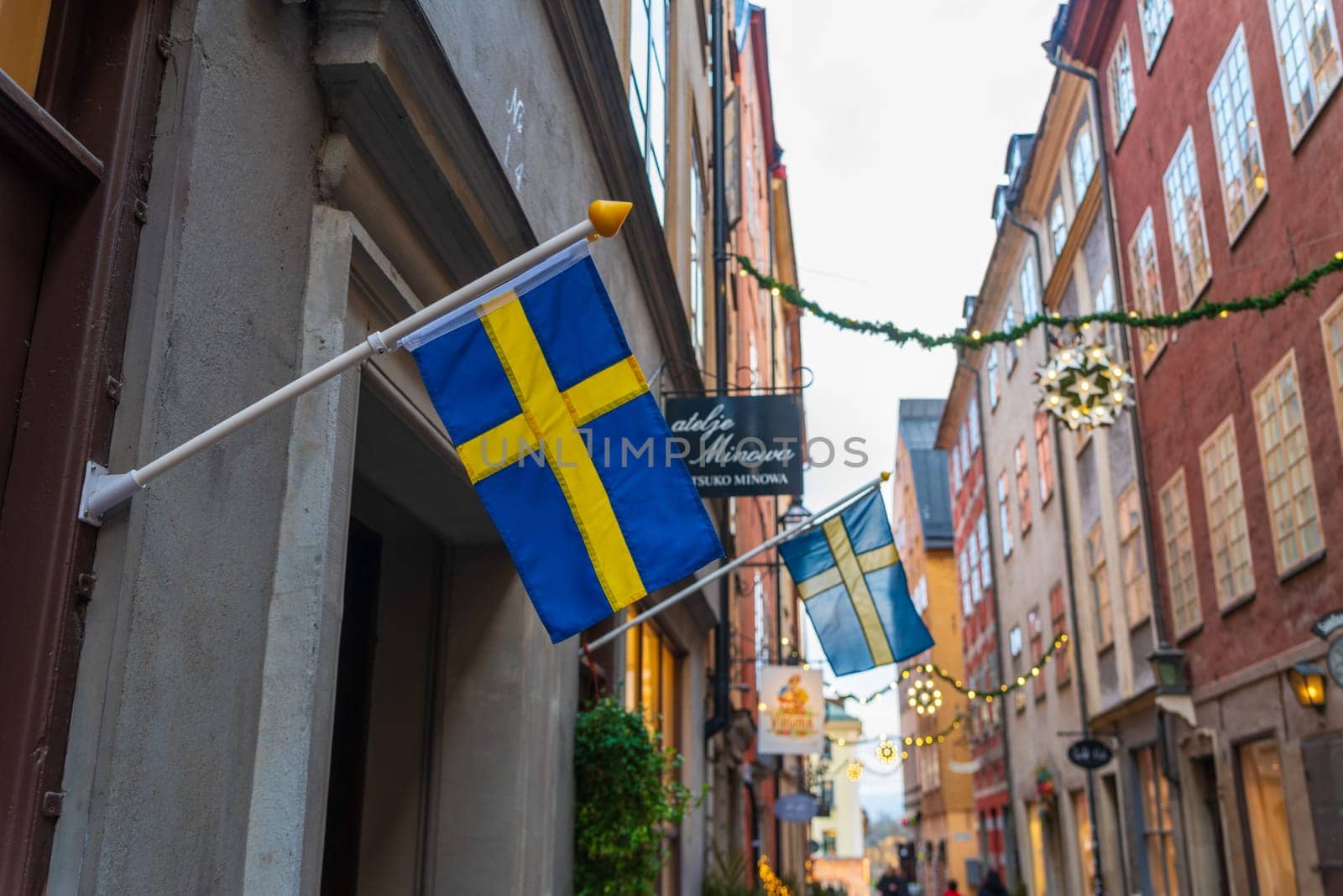 STOCKHOLM, SWEDEN- DECEMBER 23, 2020: Swedish flag in the old city center of stockholm
