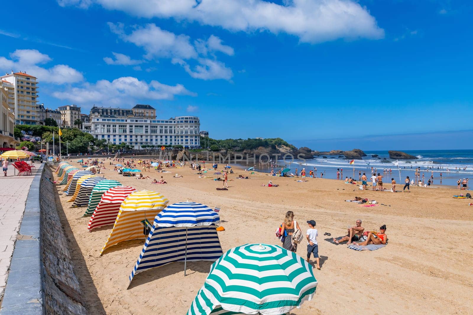 Biarritz, France, July 03, 2023: People at the beach Grande Plage (Big beach) in the French resort town of Biarritz.