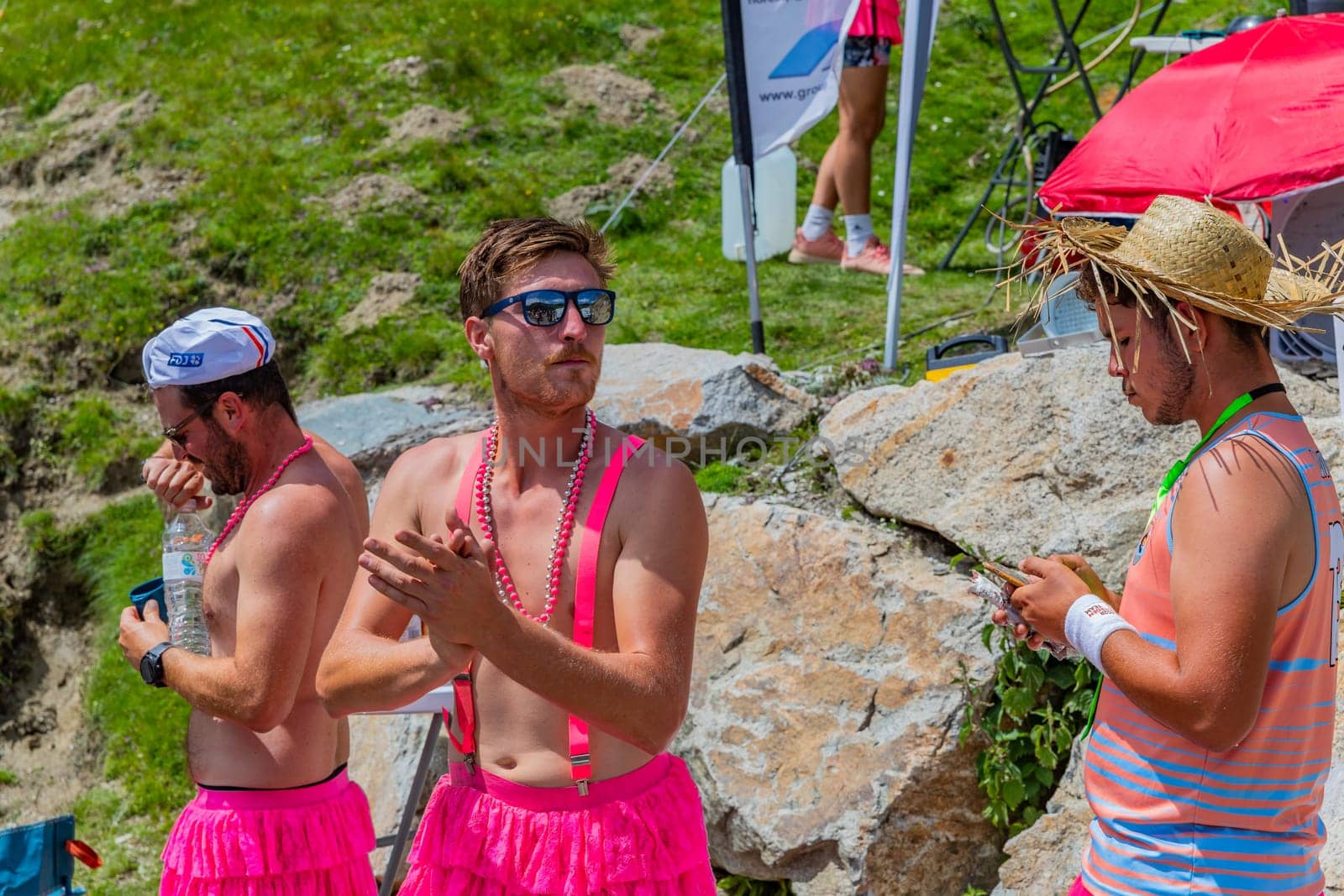 Col du Tourmalet, France - July 06 2023: Cycling fans waiting for the buch at the top of the Col du Tourmalet in Pyerenees mountains during the stage 6 of Le Tour de France 2023
