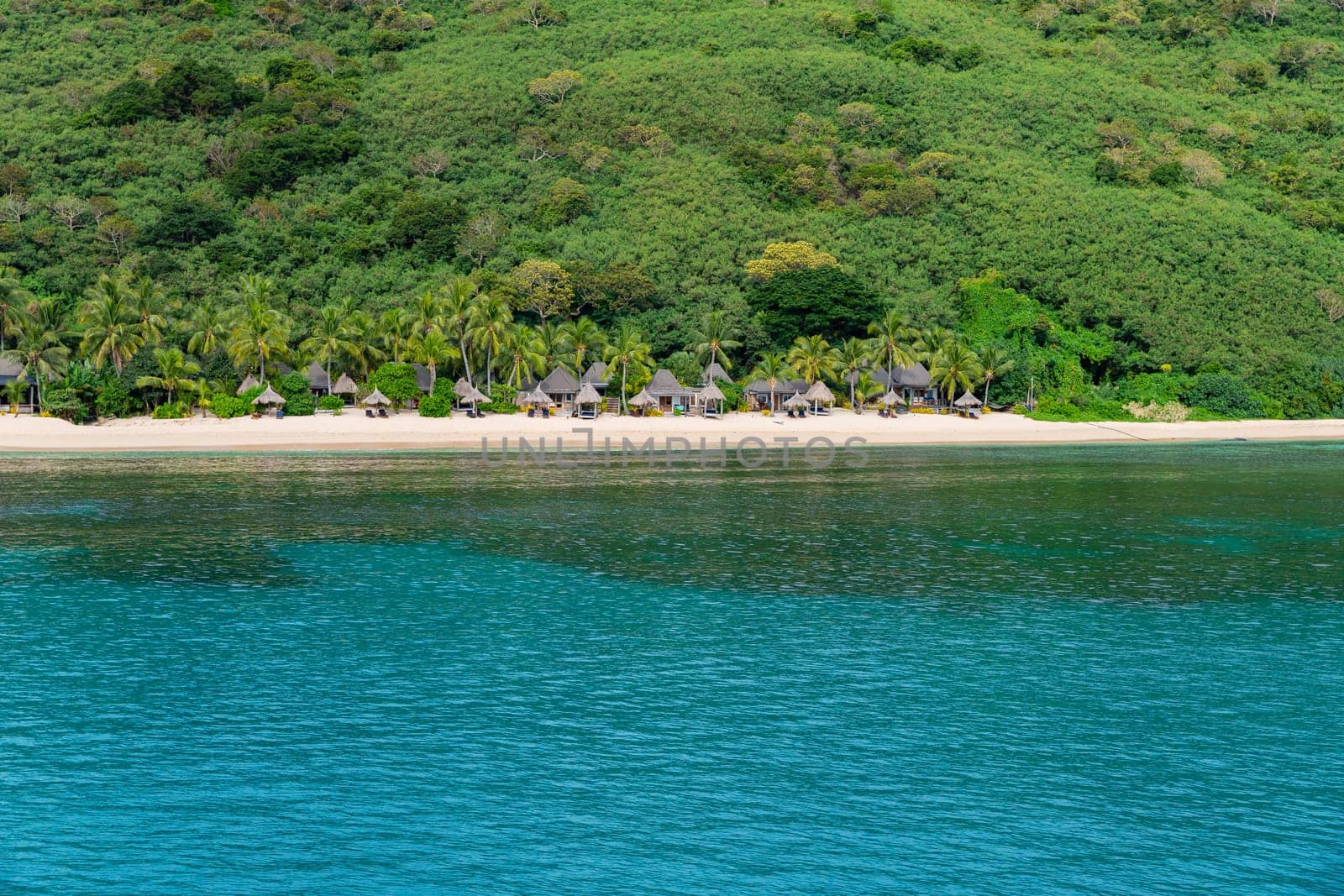 Fiji: 26 May 2023: Bungalows on beach at tourist resort, Yasawa Islands, Fiji. South Pacific Islands Pacific