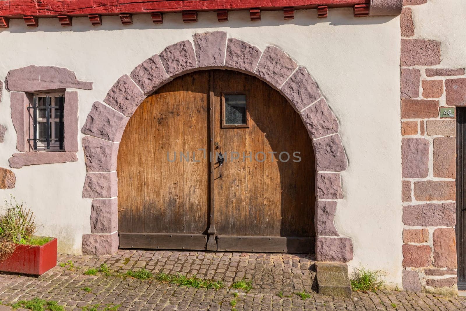 Saint Jean Pied de Port, France, July 03, 2023: Old door in Saint Jean Pied de Port, France in Saint Jean Pied de Port Basque Country, France
