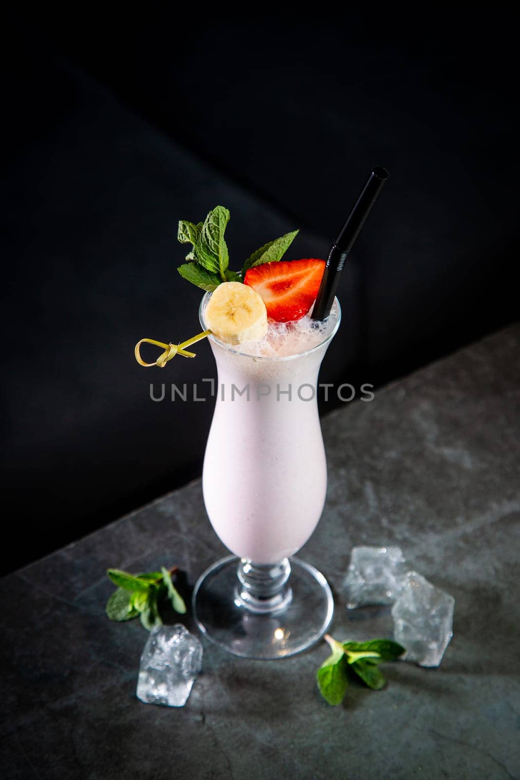 milkshake with strawberries, banana, mint and ice