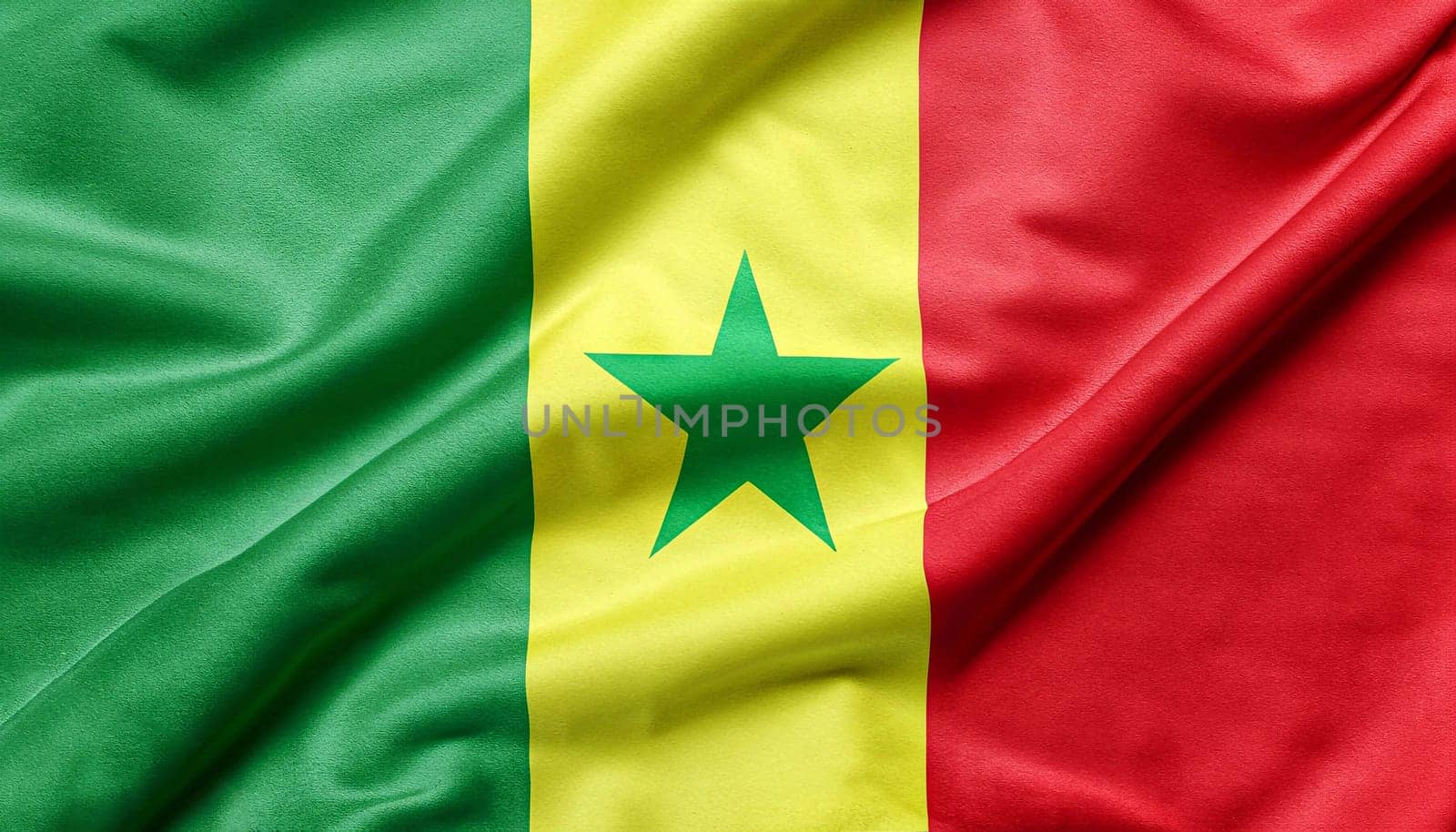 The flag of Senegal on water.flag of senegal folded with visible satin texture