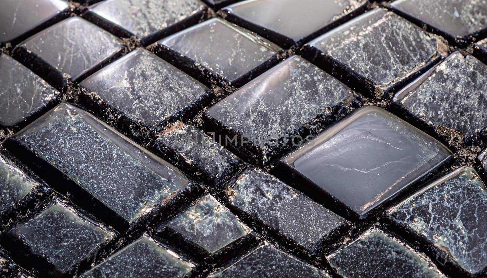 Black Obsidian semi precious stone texture with a gold leaf for exclusive interior design.