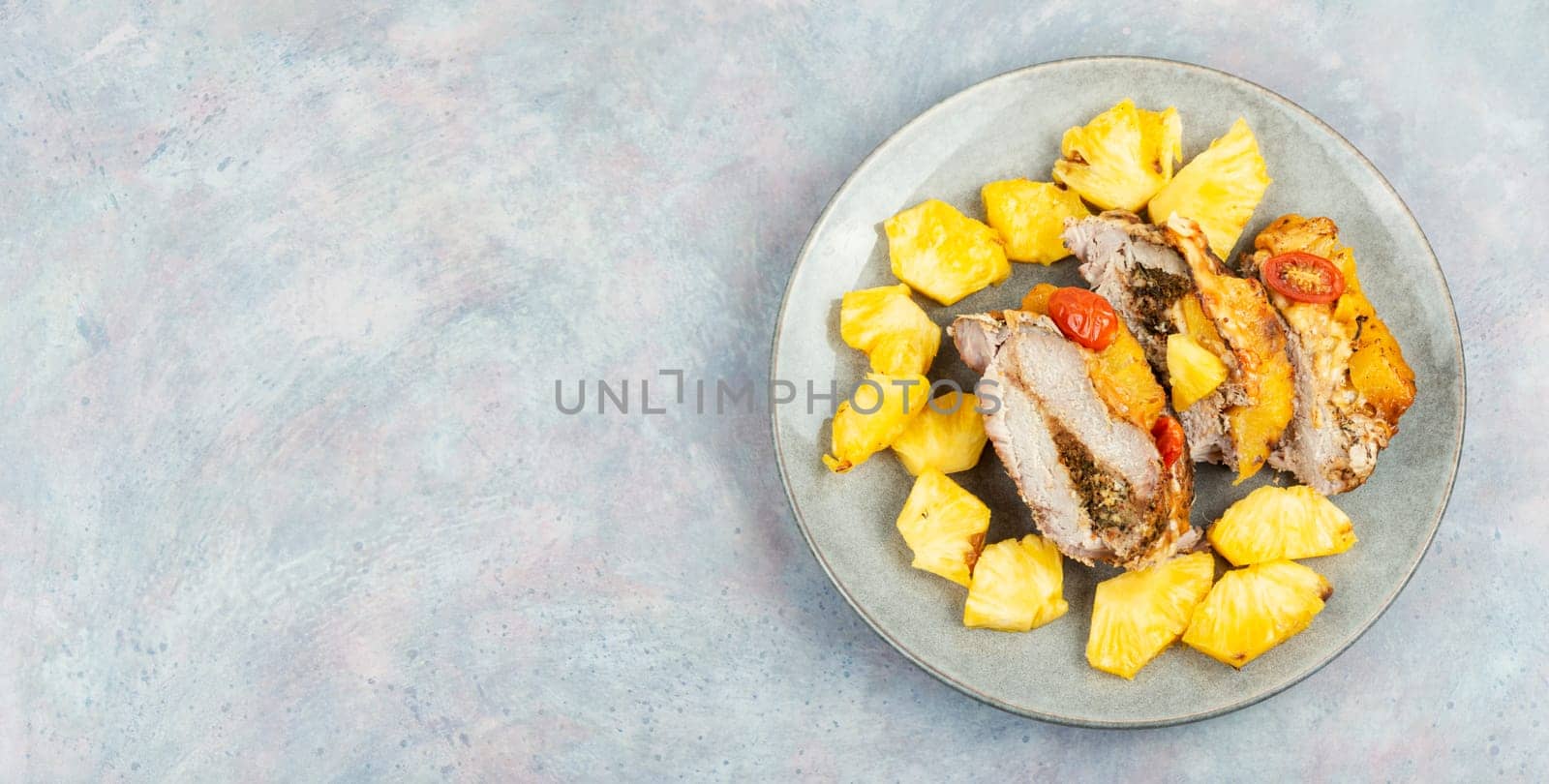 Appetizing meat roasted with fresh pineapple. Flat lay with copy space