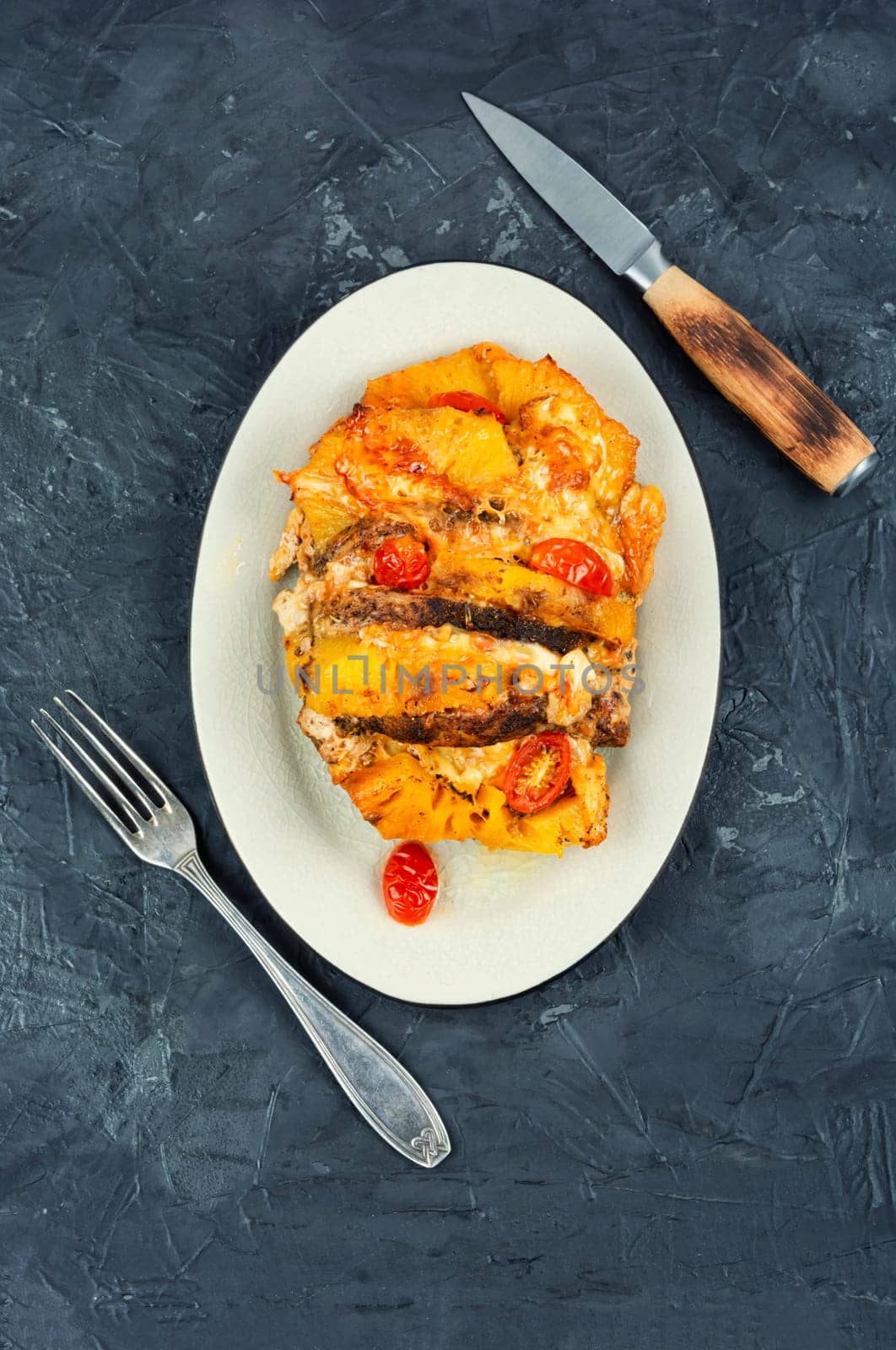 Appetizing meat roasted with fresh pineapple. Flat lay with copy space