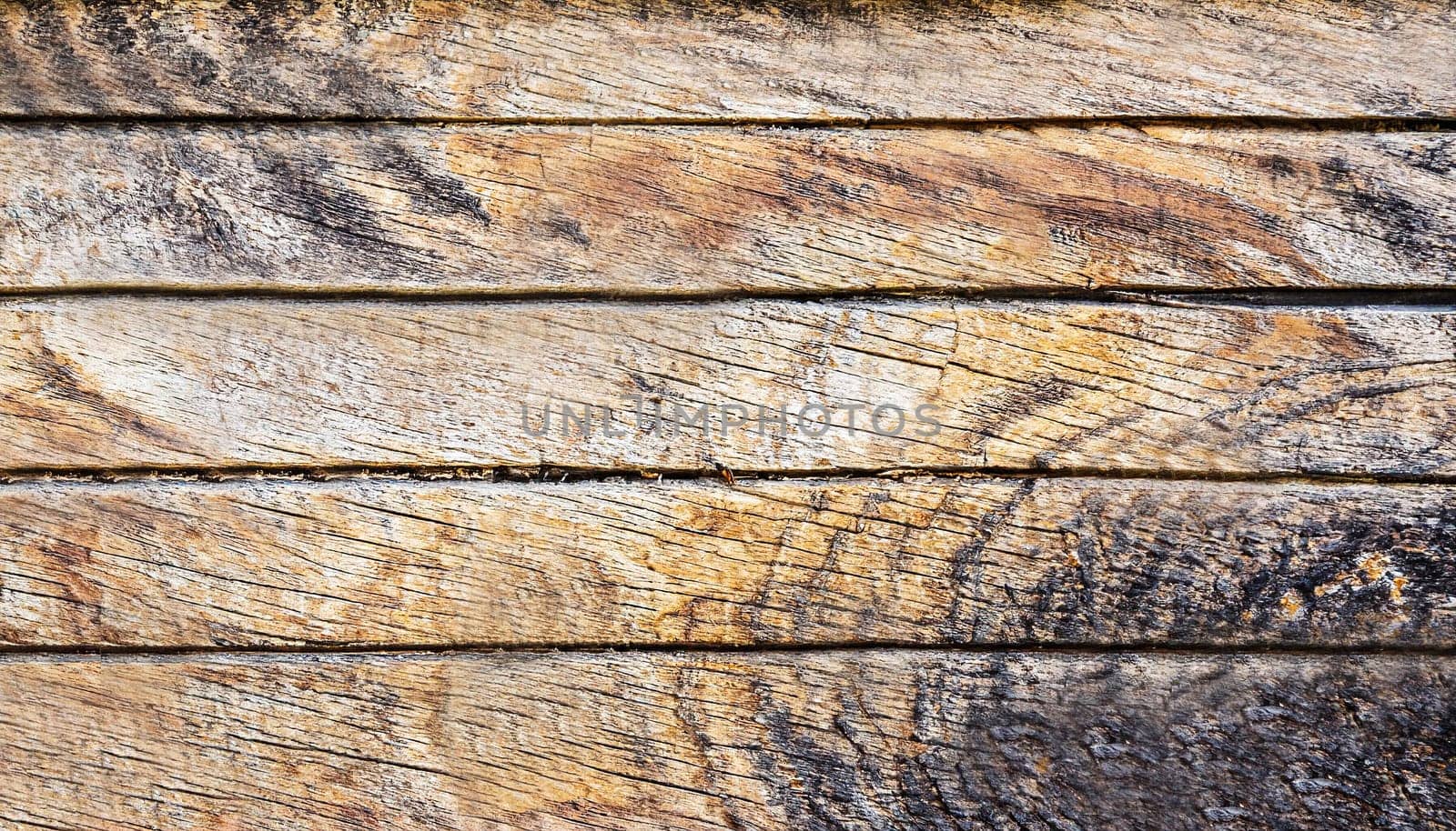 Surface of old brown chipped and deteriorated wood texture