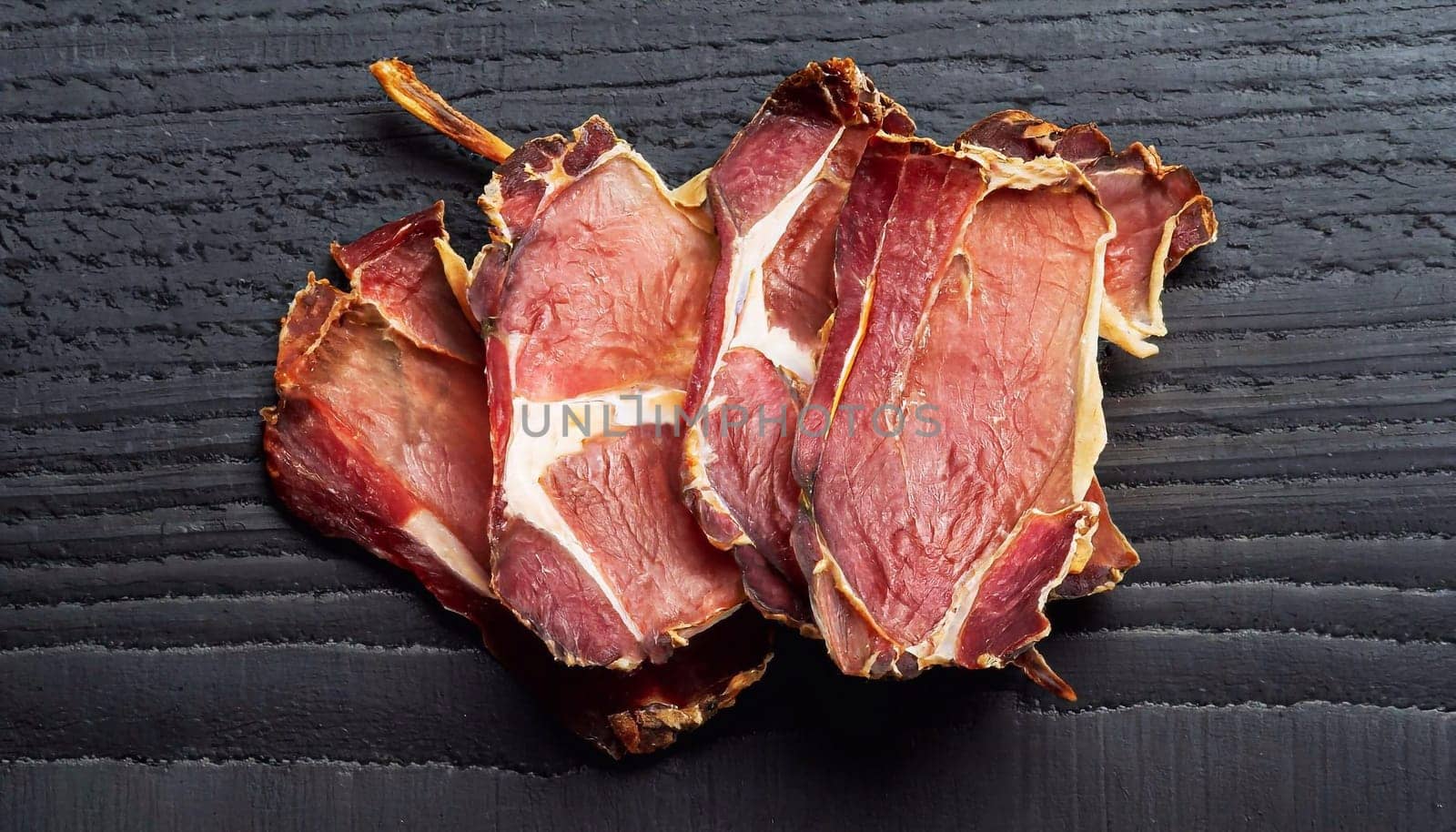 a piece of raw beef meat isolated on white background, studio photo
