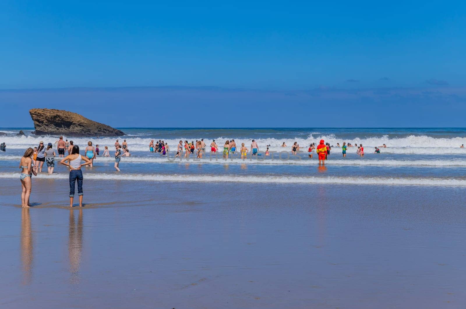 Biarritz, France, July 03, 2023: People at the beach Grande Plage (Big beach) in the French resort town of Biarritz.