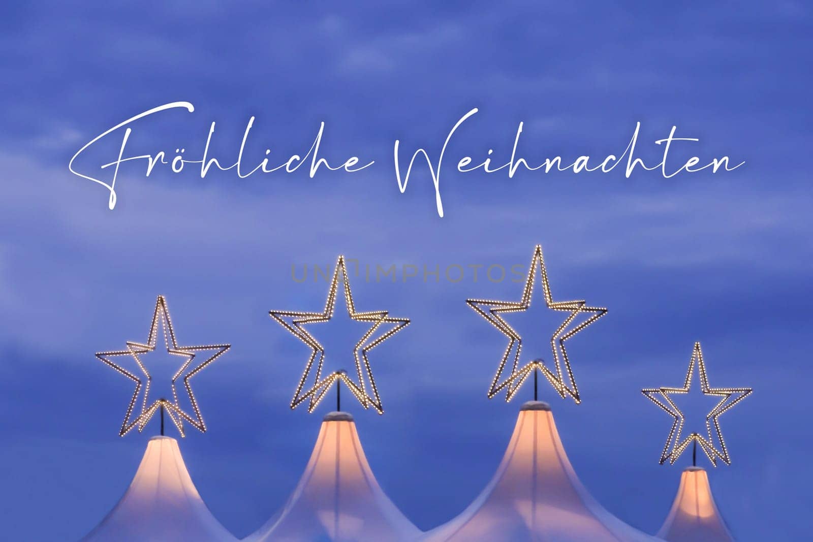 Wonderful x-mas season scene for visual or greetings card. Beautiful market tents with magic orange stars and blue sky at evening time.