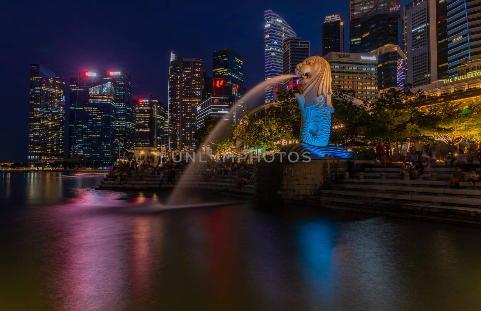 Singapore - June 04, 2023 - Merlion fountain in front of the Marina Bay Sands hotel in Singapore. Merlion is a imaginary creature with the head of a lion, seen a symbol of Singapore