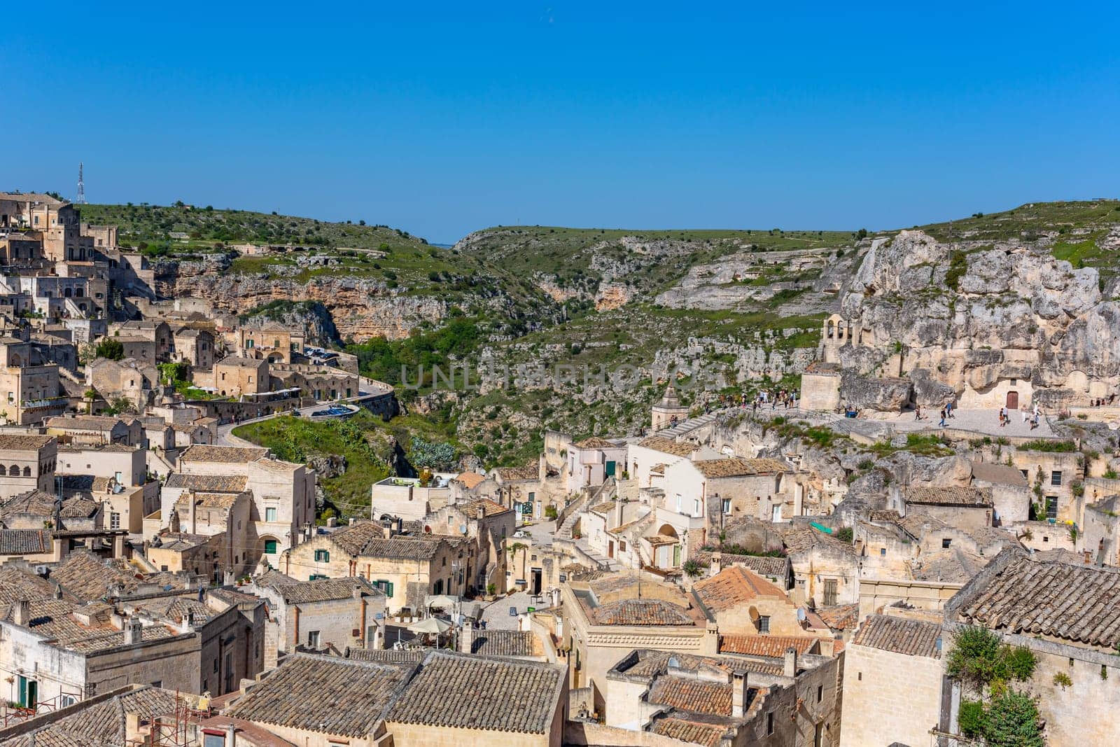 Matera, Italy - 6 May 2023: Old town of Matera (Sassi di Matera), Basilicata, southern Italy. Prehistoric cave dwellings
