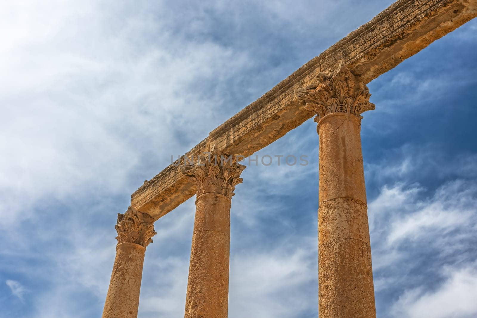 Ancient Roman ruins with blue sky in the background at Jerash.  Jordan.