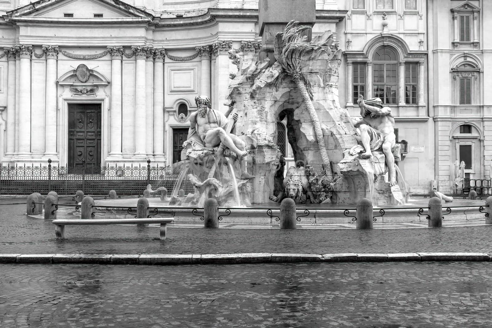 Black and white photo of empty  Navona Square with famous fountain in Rome. Italy. Horizontally.