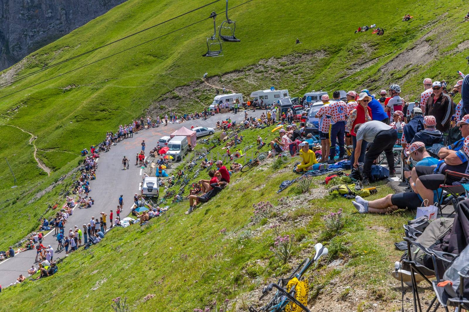 Col du Tourmalet, France - July 06 2023: Cycling fans waiting for the buch at the top of the Col du Tourmalet in Pyerenees mountains during the stage 6 of Le Tour de France 2023